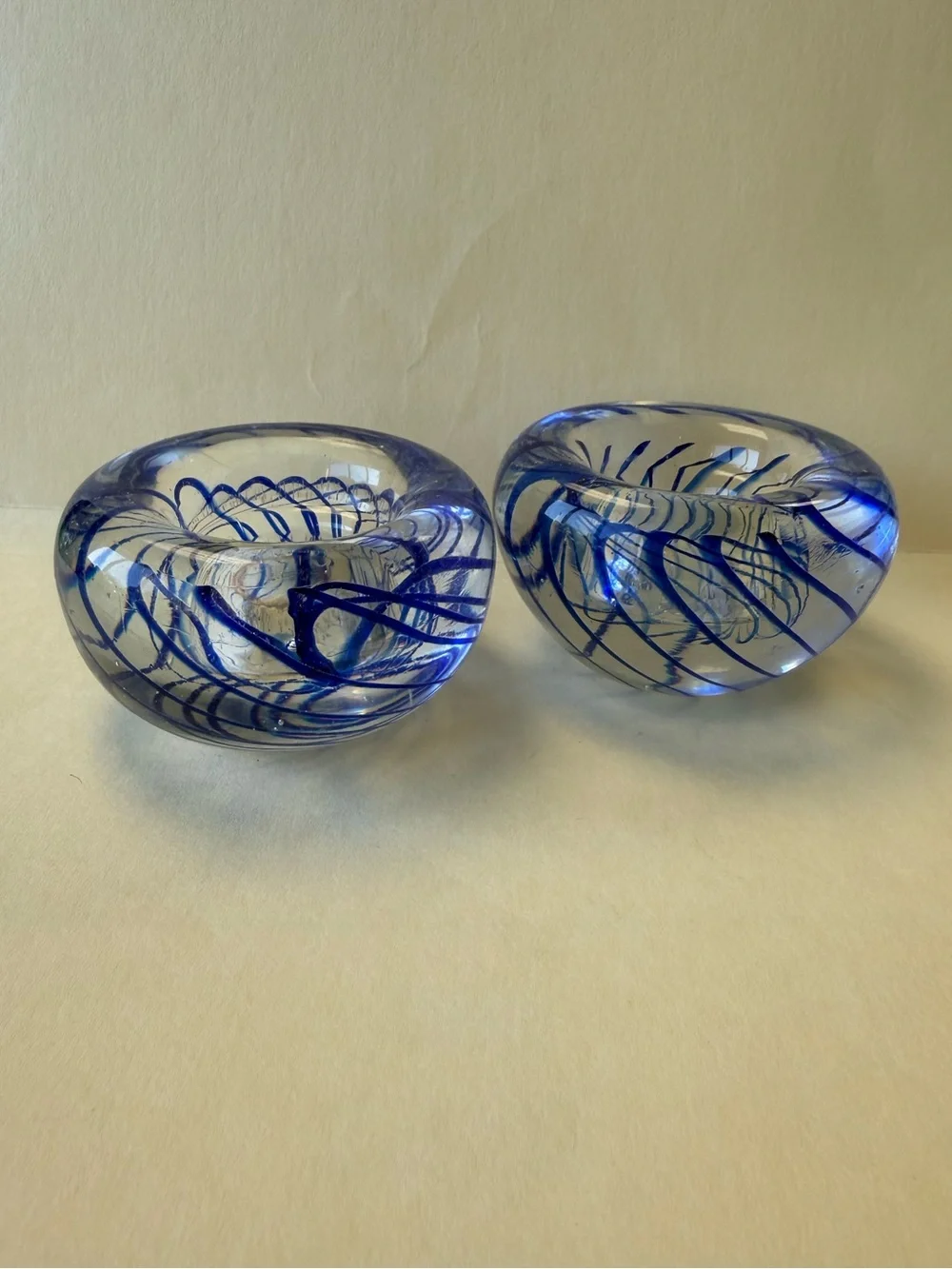 Pair of Handmade Art Glass Paperweight Candle Holders. Clear with Blue Swirl.